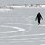 figure on frozen lake walking a circle