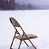 chair on frozen lake